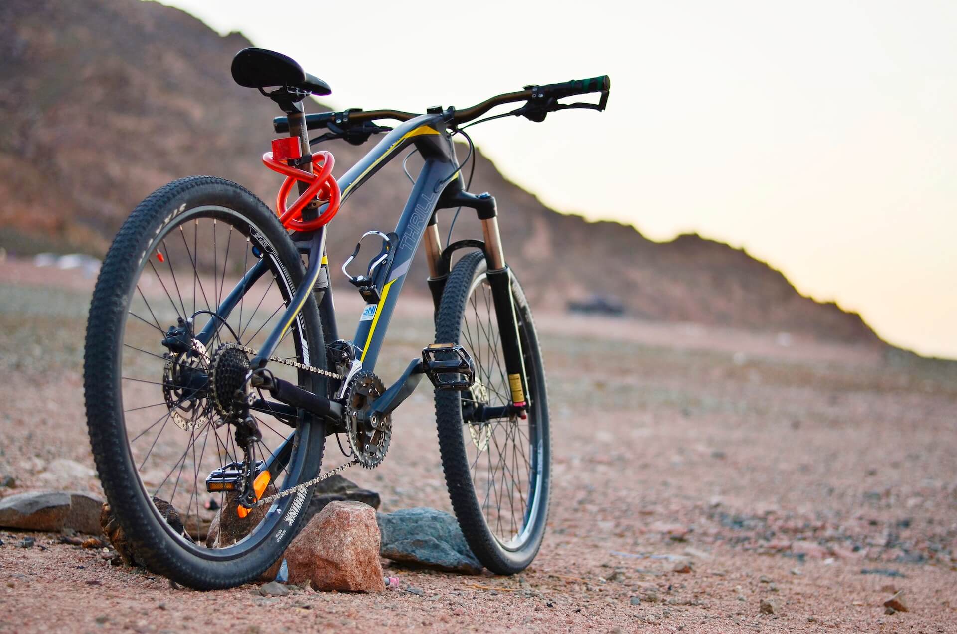 Hardtail mountain bike on rock at dusk in the Atlas foothills