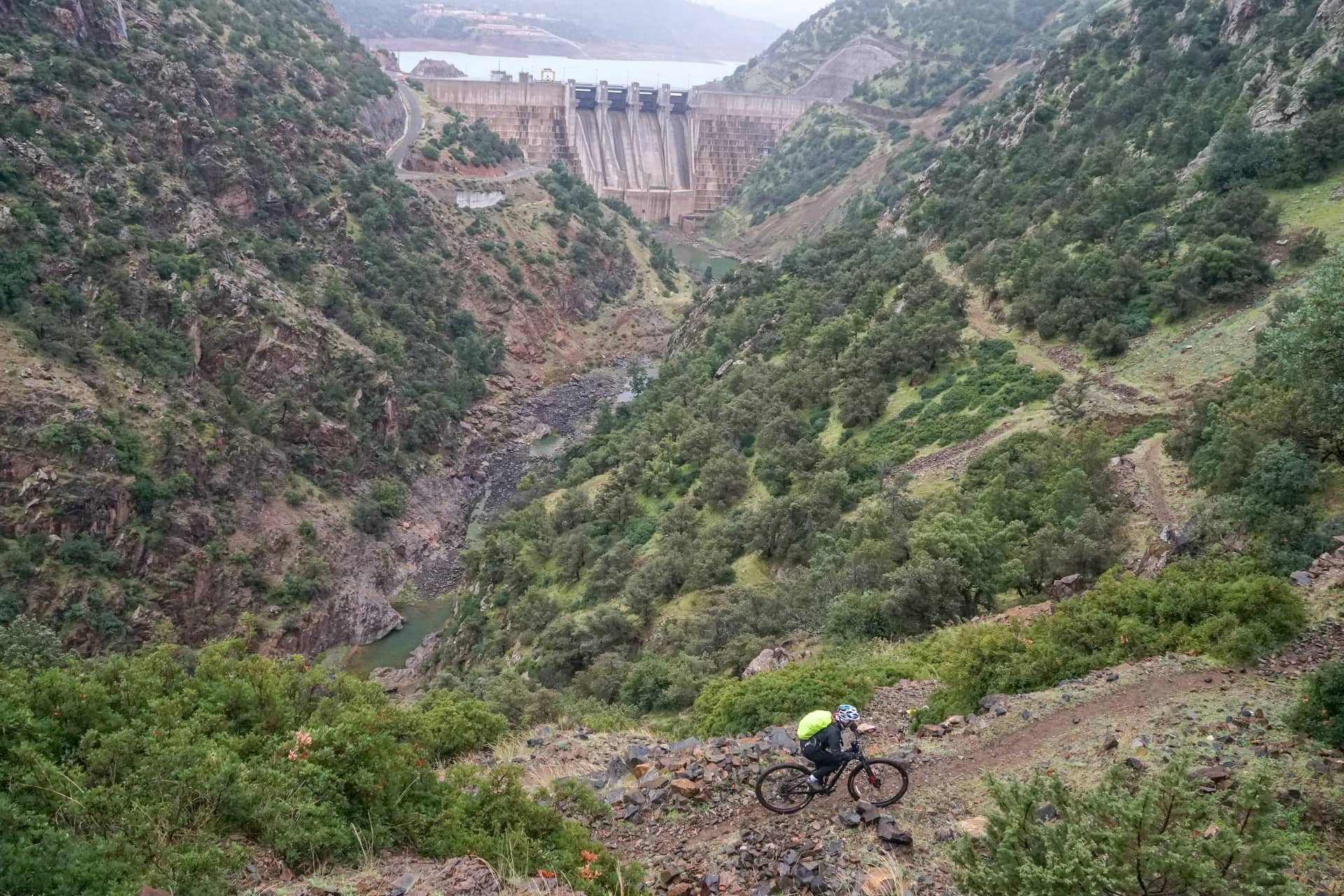 Rider on the piste above the Lalla Takerkoust dam wall and reservoir