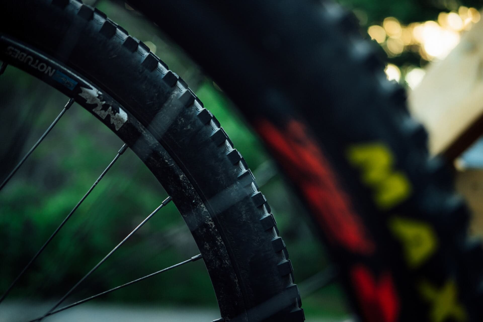 Close-up of a mud-covered enduro bike wheel